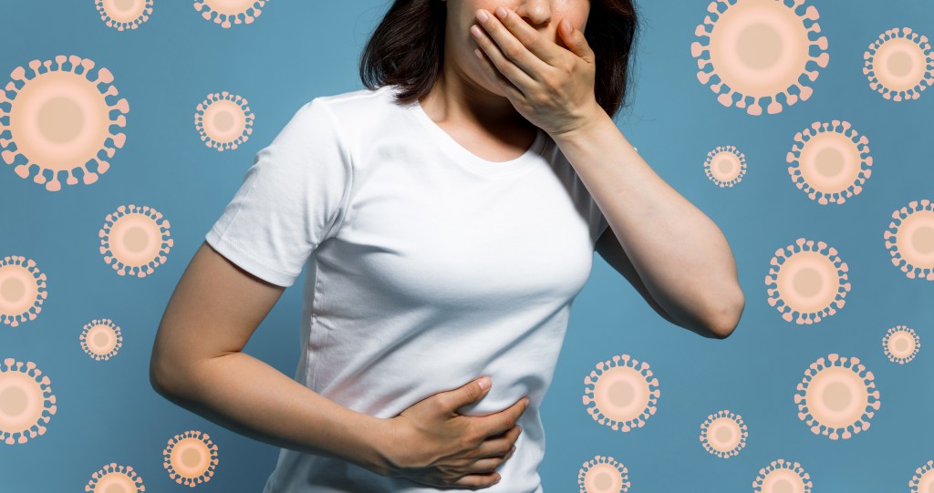 woman holding stomach and mouth looking sick